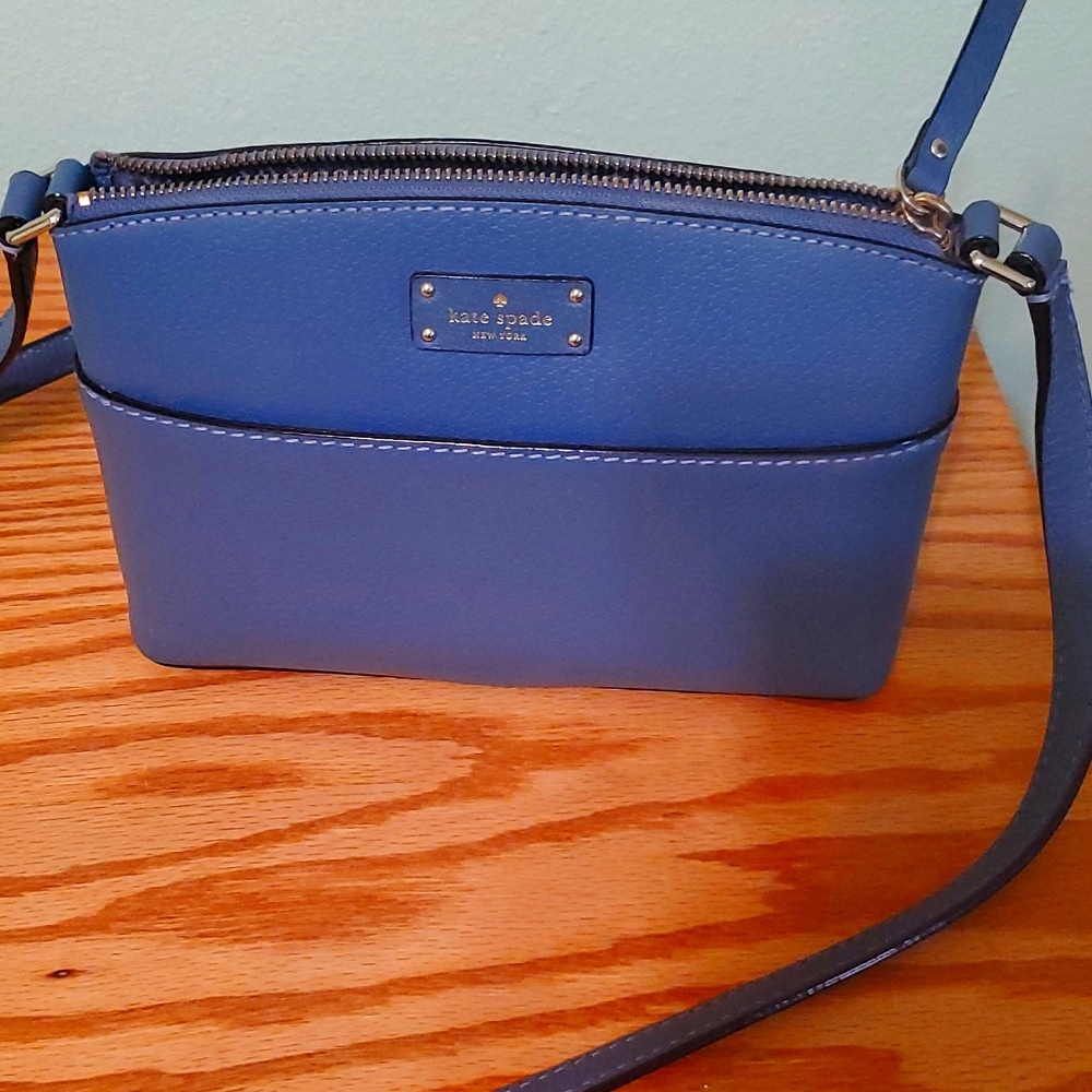 Kate Spade new with out tag. Slate blue. Measurements 9" wide, 6" high,bottom 3"